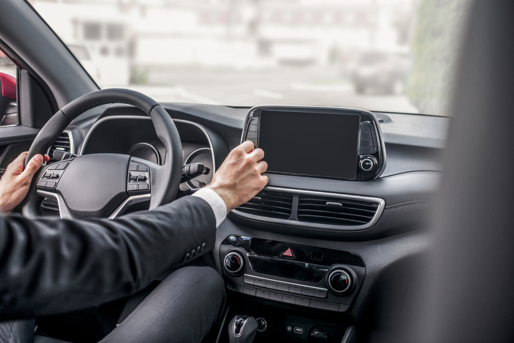 Drive,Test.,Rear,View,Of,Male,Hands,Adjusting,Car,Settings